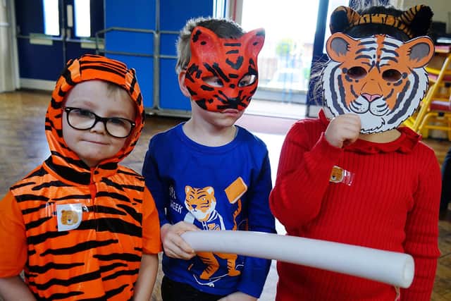 Henry Bradley Infant School Hedgehog reception class wearing their red - a popular colour in Chinese culture - and tiger themed outfits