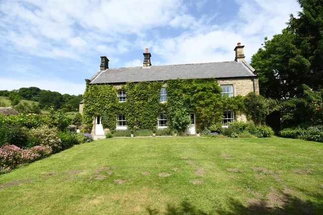 This farmhouse only has four bedrooms, but also features a four car garage and over 1.5 acres of private land. It has a price tag of £975,000.