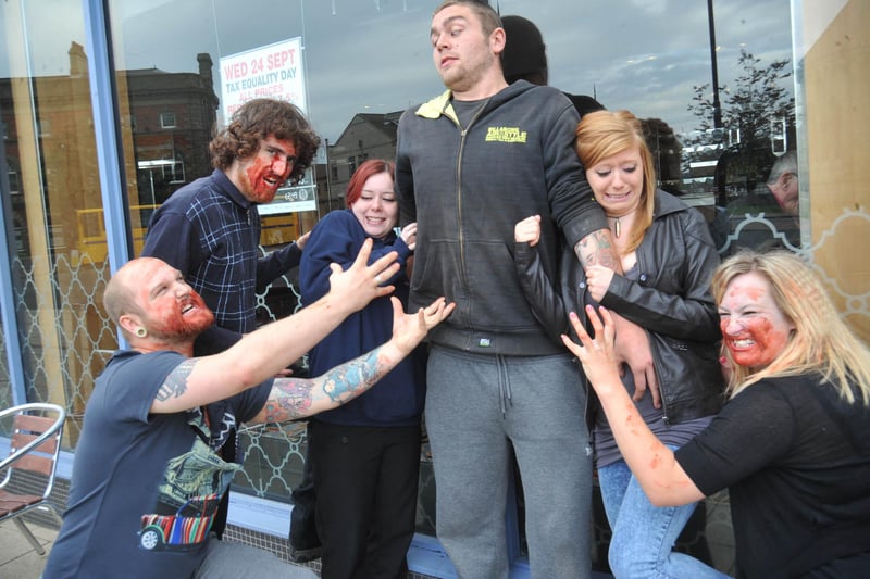 Zombies and survivors (left to right) Dan Mason, Richard Walker, Hannah Smith, Matty Shea, Alex Rodgers and  Kate Barratt rehearse for an event 7 years ago - but who can tell us more?