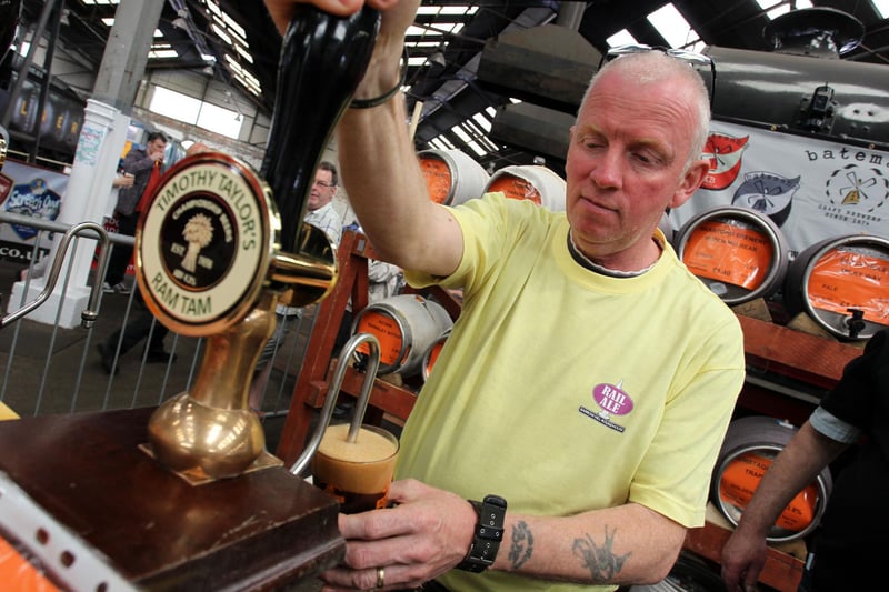 Mark Buxton worked behind the bar at the festival in 2014, pulling pints of Timothy Taylor's Ram Tam among others.