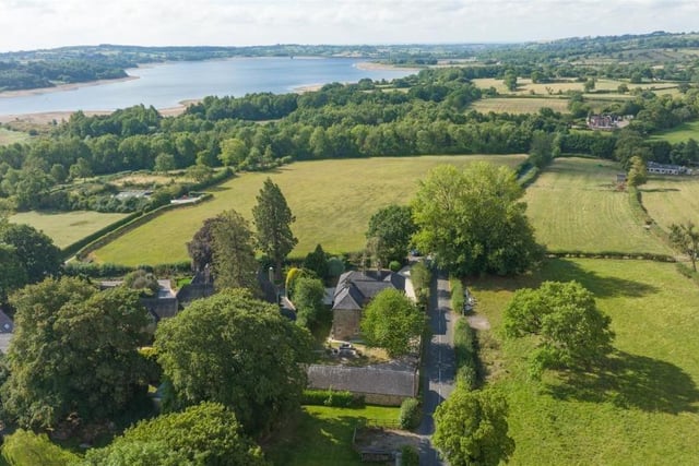 Drone footage shows Thornhill House surrounded by countryside with Carsington Reservoir in the distance.