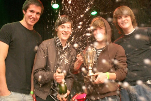 The Crooks pop a champagne cork to celebrate winning the Derbyshire Times band of the year competition.