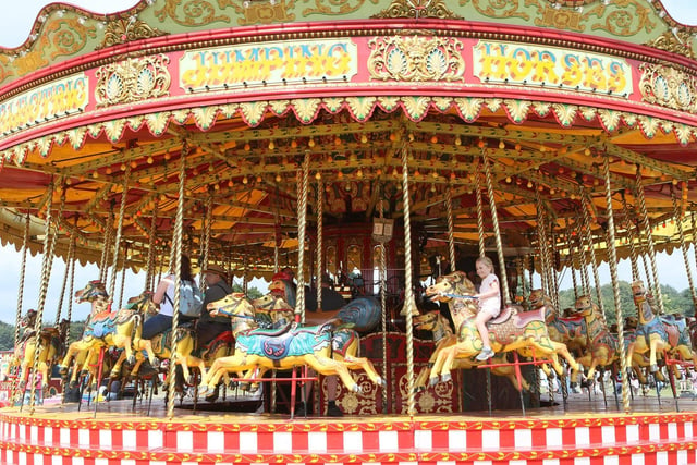 Children had fun on the carousel, one of the many rides at the vintage fairground.