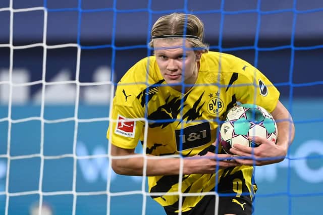 The bookies have their say on Chelsea, Man City, Liverpool and Man Utd's chances of landing Borussia Dortmund star Erling Haaland this summer. (Photo by INA FASSBENDER/AFP via Getty Images)