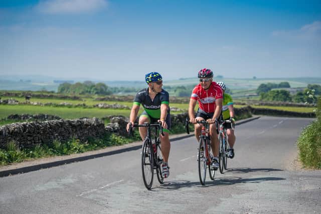 Cyclists riding from Foolow to Eyam (photo: Phil Sproston/Visit Peak District & Derbyshire)