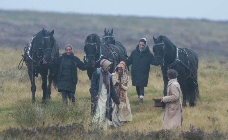 Becky Spackman posted about this photo: "I just love how the horses are timeless, they look 'right' in their normal harness whether in a period drama or out for exercise any day of the week. We have the same breeds, same training, same temperament, same harness...also humans in long coats...all horsey ladies know that long coats below the knees are the answer to surviving the weather no matter the time period!" Apple Taylor commented: "Perfect misty moors weather for atmosphere!" (photo: Richard Bowring)