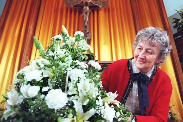 A flower festival was held at Hall Gate United Reformed Church, Doncaster, to help celebrate 200 years of Christian worship in the centre of town in 1998. Our picture shows Jean Owen, a member of the Doncaster Flower Club, admiring a arrangement by church member Janet Welsh.