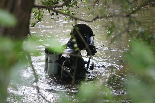 Police divers searching for Mr Snell's body parts in Newland Gardens, Newbold, in 2019.