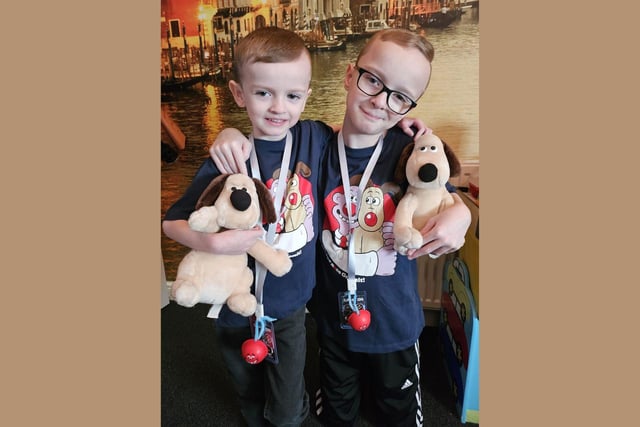 Cory and Eli are celebrating Red Nose Day 2024 with their teddy dogs!