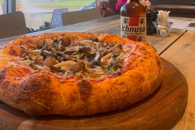 Deep  pizza base laden with mushroom topping.