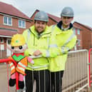 The site team with the elf, who are promoting staying safe on site