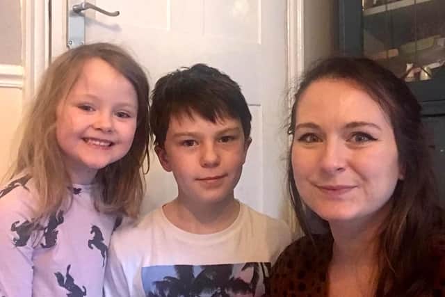 Kate Bodell, with two of her children Lola, five, and Ellis, nine, both of New Whittington Primary School, who were shocked when David Walliams replied to their request.