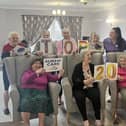 Staff and residents celebrate the award