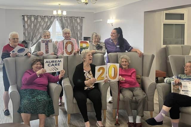 Staff and residents celebrate the award