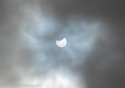 Brad Moore spotted the eclipse as it peeked through the clouds over Chesterfield