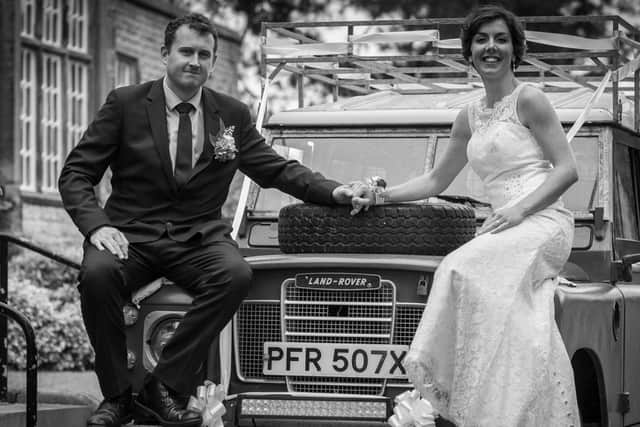 Jack and Kennedy Wynne on their wedding day are pictured with their vintage Land-Rover outside Newholme Hospital in Bakewell.