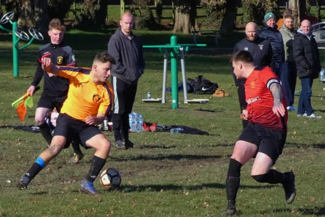 Action from Grassmoor Reserves (red) v AFC Tiki in a ten-goal thriller. Photo by Martin Roberts.