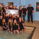 Rykneld Swimming Club with the donation from Taylor Wimpey.