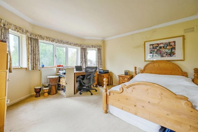 The main bedroom features front windows which provide delightful garden views.