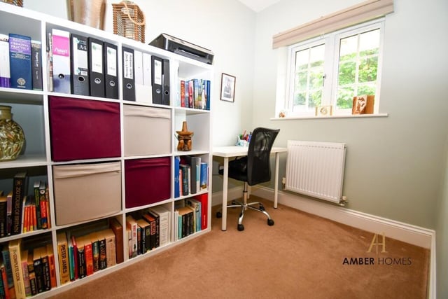 This versatile room on the ground floor is currently being used as a home office. But it could easily be converted into a playroom or a guest suite.