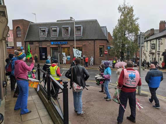 Extinction Rebellion samba band and cleaners at Barclays Bank, Chesterfield.