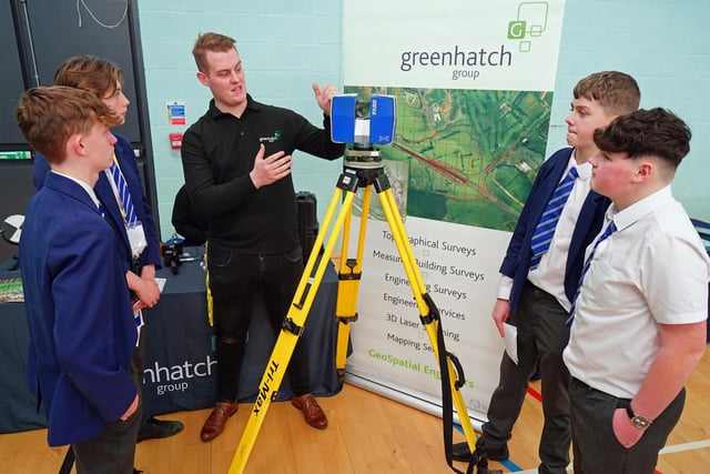 Many alumni attend the careers fairs to inspire current pupils. Above a former student Matthew Kirk is talking to pupils about the Greenhatch Group.