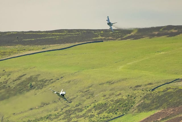 The jets were captured roaring over the Peak District just a few hundred feet apart.
