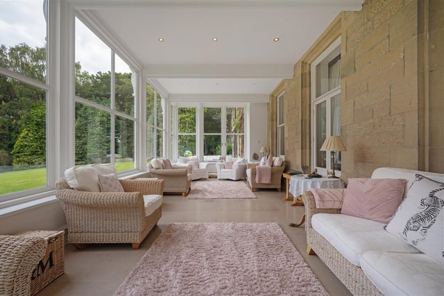 A recent addition to the hall, the orangery enables occupants to take in the stunning views of the garden while staying warm  thanks to the underfloor heating.