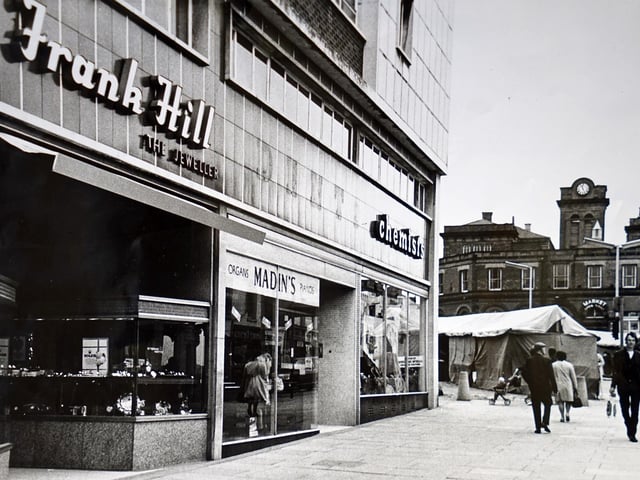This image from 1974 shows popular shops Frank Hill jewellers, Madin's Music and Dents the chemist on the corner. The market hall clock tower looked different 50 years ago too.