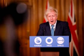 Boris Johnson speaks during a virtual press conference inside 10 Downing Street this afternoon (Photo by TOLGA AKMEN/AFP via Getty Images)