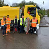 Pictured are Bolsover District Council and Scarab officials standing with the new street sweeper