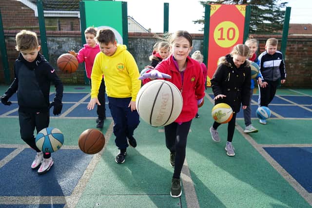 Hardwick class playing basketball at Palterton Primary