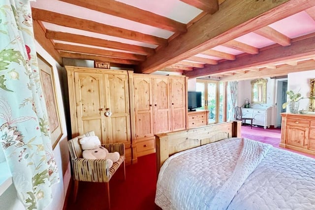 The property's principal bedroom, which boasts extensive wardrobe space, sits on the ground floor.