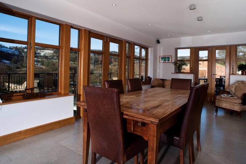 The spacious dining room enjoys rural views over the Shibden Valley.