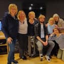 WASPI campaigners Denise Baker, Linda D'Agata, Moira Holland, Lesley Hardy, Patricia Clough, Angela Madden, Joan Lye-Green, Janet Goodrich and Carol Mullins are pictured with record producer Martyn Stonehouse.