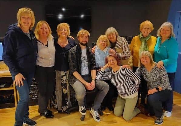 WASPI campaigners Denise Baker, Linda D'Agata, Moira Holland, Lesley Hardy, Patricia Clough, Angela Madden, Joan Lye-Green, Janet Goodrich and Carol Mullins are pictured with record producer Martyn Stonehouse.