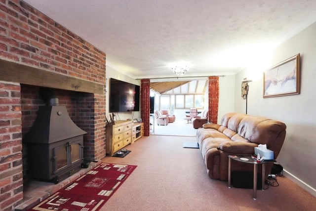 Next stop on our tour is this large living room or lounge. Its most distinctive feature is a multi-fuel log-burner.
