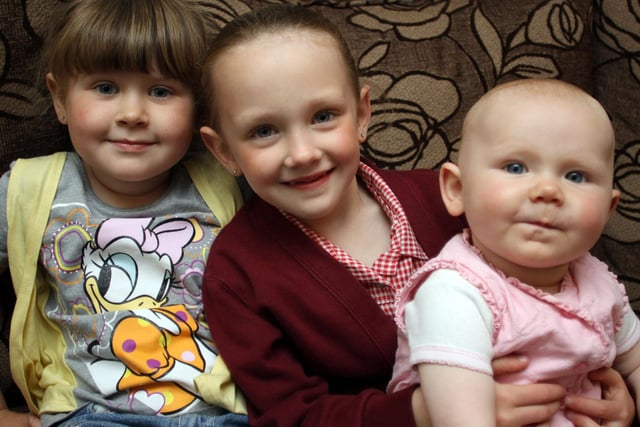 Newbold girl saved baby sister from choking. Ellie-Mae Cruickshank with Maddison and sister Evie (left) in 2010