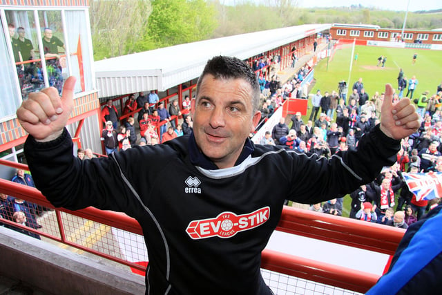Robins boss Kevin Wilson celebrates after the game.