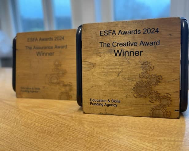 Receiving an ESFA award designed and created by Anthony Gell School Students