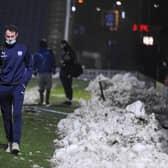 Liam Mandeville leaves the Technique Stadium on Tuesday night after Chesterfield's match against King's Lynn Town was postponed due to a waterlogged pitch.