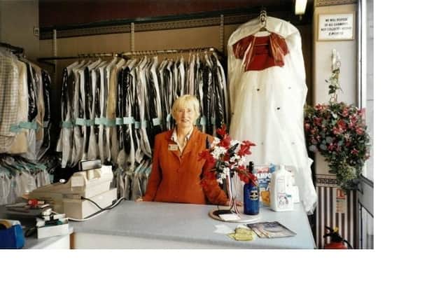 Glenys Falconer working at her brother-in-law's dry cleaning shop in Chesterfield.
