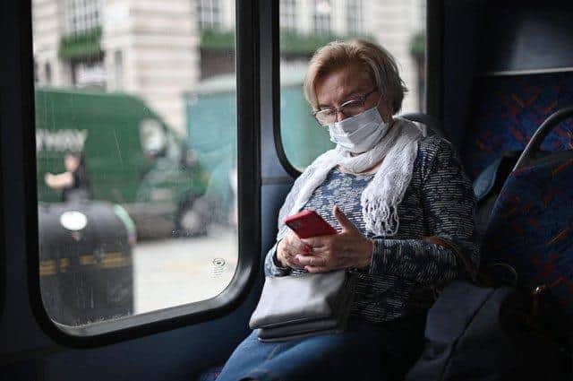 Wearing a face covering on public transport will soon be mandatory in England again.