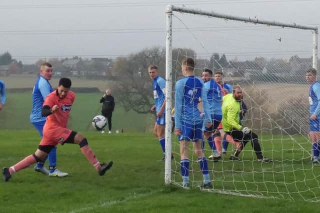 Shinnon defend a corner against Spotted Frog in HKL Three back in November. Photo by Martin Roberts.
