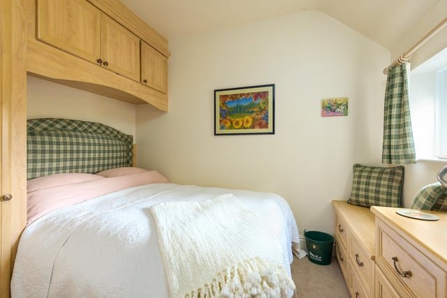 The second bedroom is considerably smaller, but can still fit a large double bed/