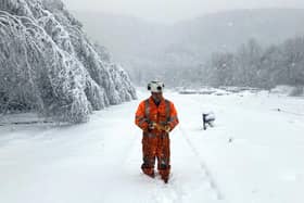 A Network Rail worker in snow up to eight inches above the railhead at Grindleford.