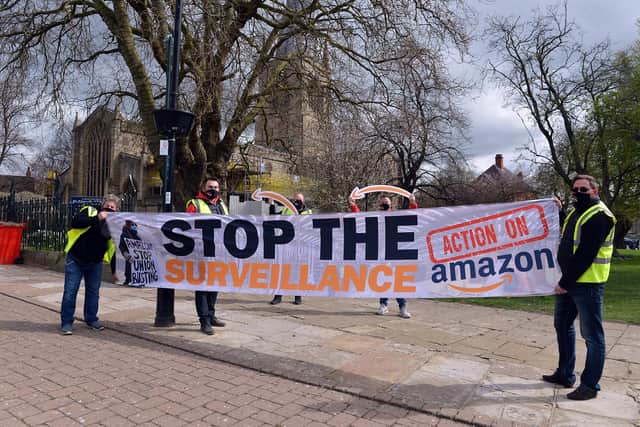 Action on Amazon campaigners outside the Crooked Spire in Chesterfield to spread the word that Amazon workers can blow the whistle on any poor treatment. Picture by Brian Eyre,