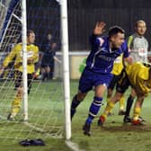 Matlock Town striker Ross Hannah turns away in delight after scoring against North Ferriby United.