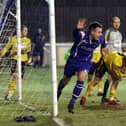 Matlock Town striker Ross Hannah turns away in delight after scoring against North Ferriby United.