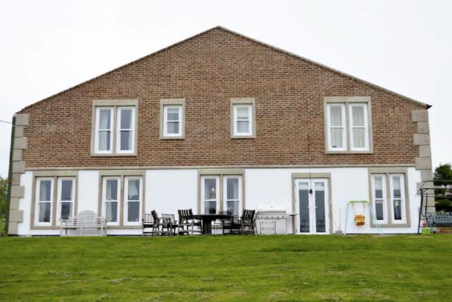 Alan Yeomans, 67, concealed half of the six-bedroomed Shedley Manor in Derbyshire with green cladding so it could not be seen from the road.